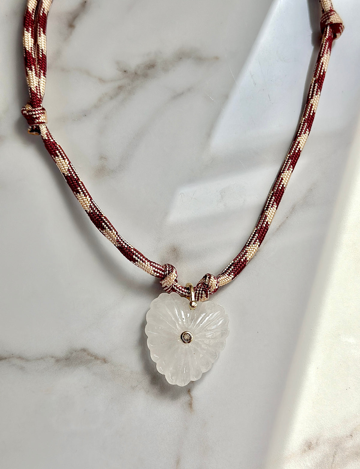 Burgundy and cream paracord necklace with natural quartz heart pendant and CZ accent.
