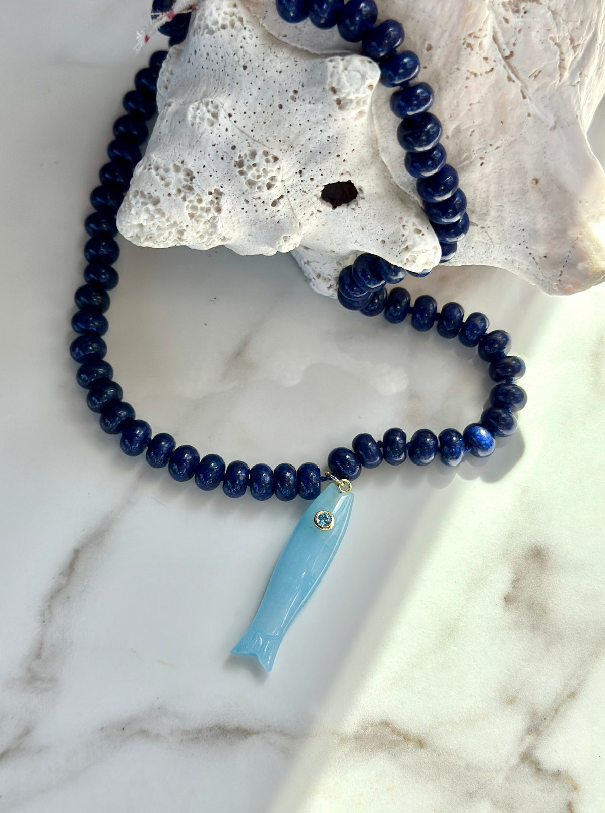 Blue gemstone fish necklace with light blue carved fish pendant – coastal jewelry
