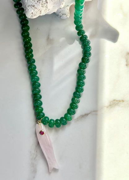 Green beaded gemstone necklace with pale pink fish pendant and gemstone accent.