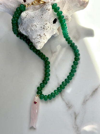 Green gemstone fish pendant necklace with pink carved fish and gold clasp.