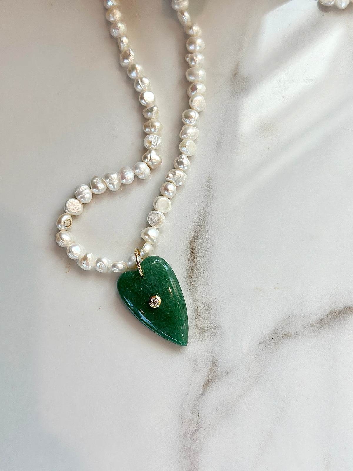 35mm green aventurine heart pendant on freshwater pearl necklace.