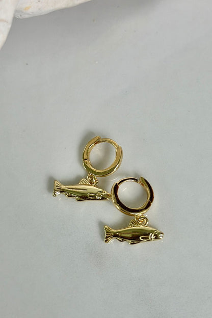 Gold Catch Hoops gold huggie earrings with detailed fish charm, lifestyle coastal photo