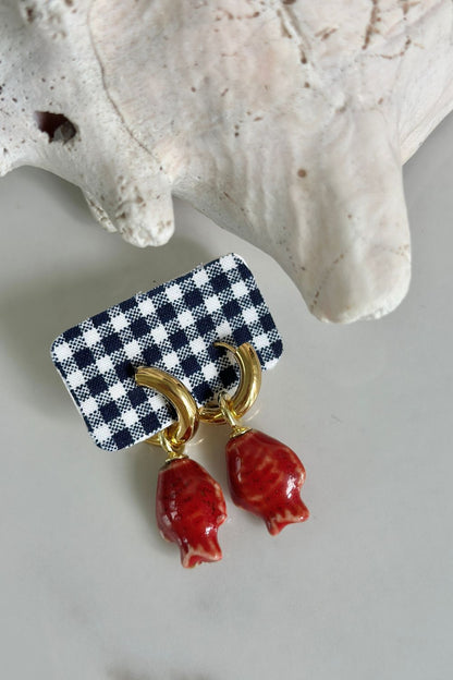 Gold hoop earrings with red glazed fish charm drop, coastal jewelry by Maritt Row
